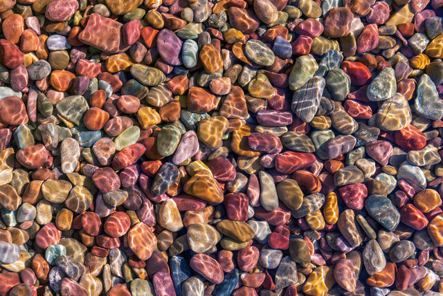 Glacier National Park colorful rocks on the shores of Lake McDonald in northwest Montana.