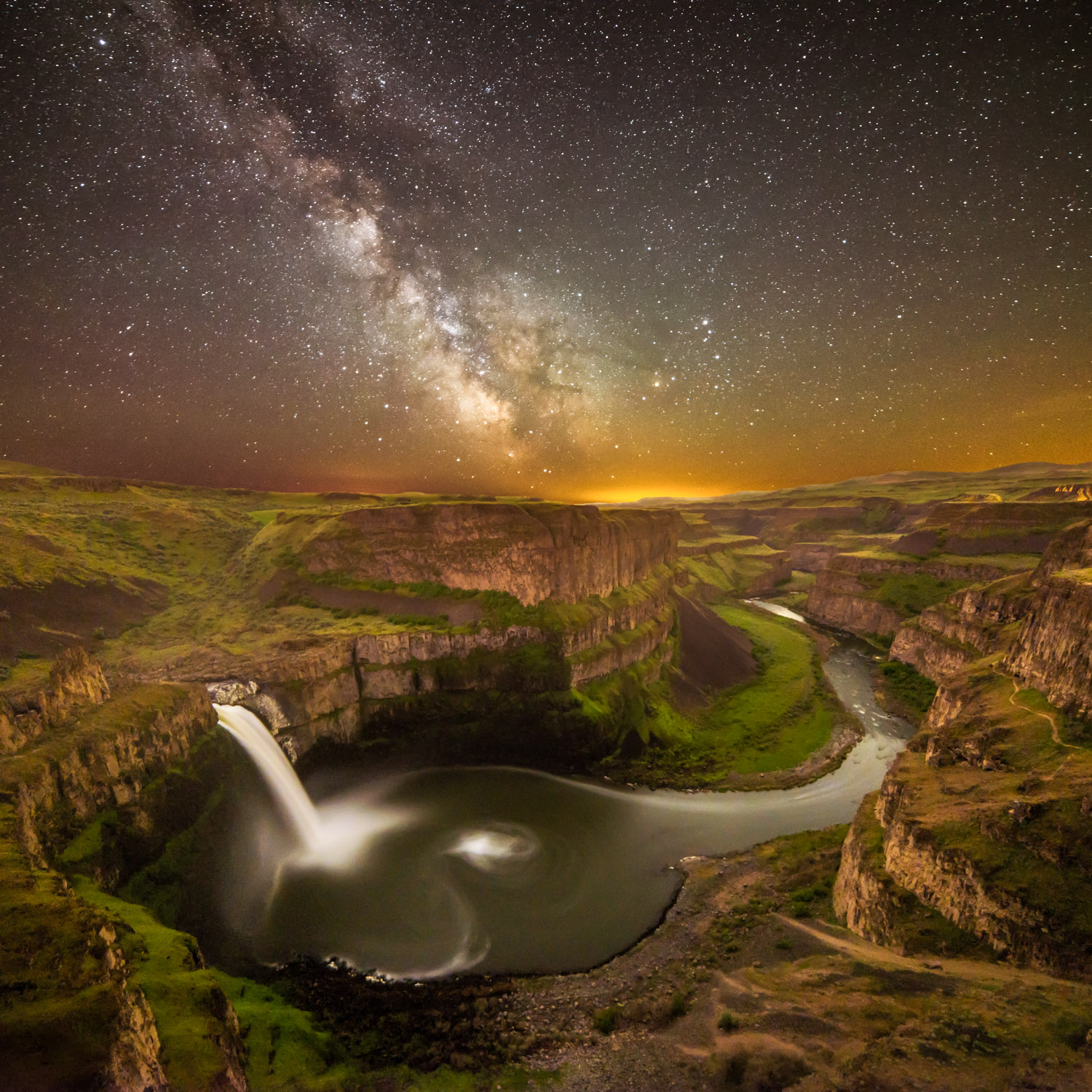 Palouse Falls at night with the Milky Way galaxy in the sky above.
